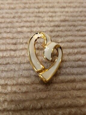 Monet stylized open heart brooch featuring a gold-tone framework